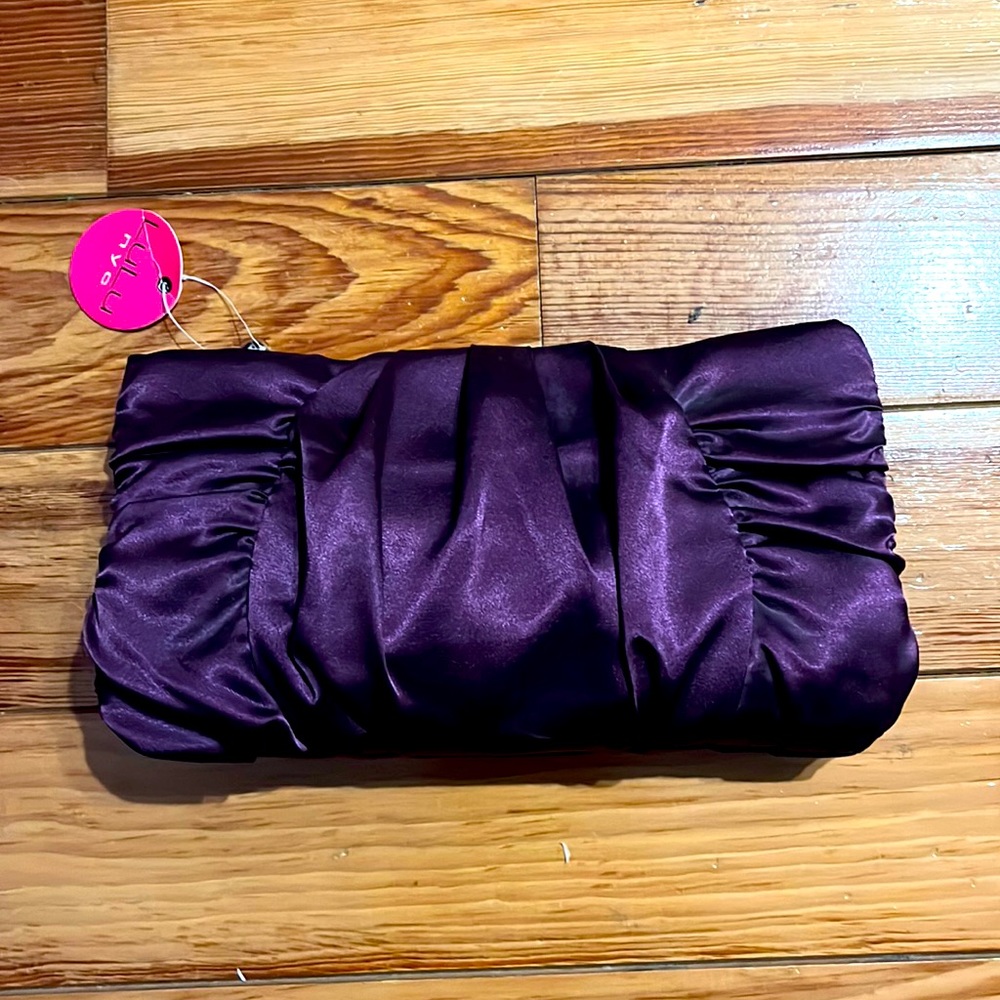Purple satin clutch bag.